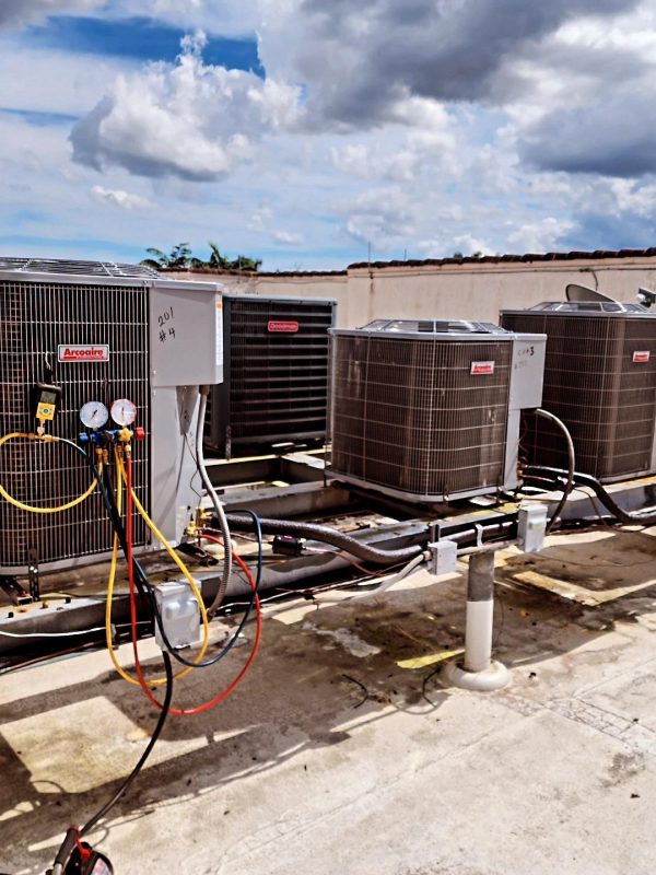 a group of air conditioning units on a roof
